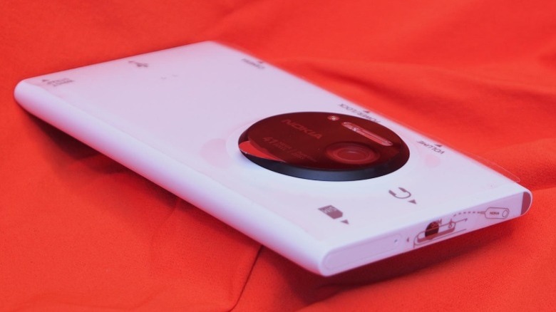 White Nokia Lumia 1020 face-down on red cloth