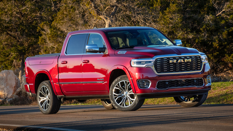 Red Ram 1500 Tungsten parked on road near forest.