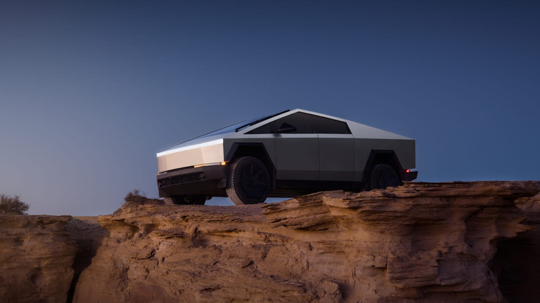 Tesla Cybertruck parked at a cliff edge.