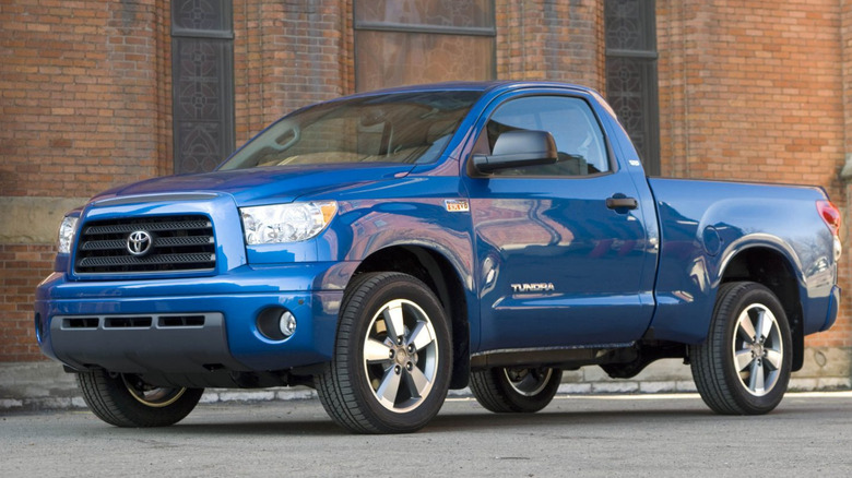 Blue 2008 Toyota Tundra with Sport appearance package in front of a red brick building.