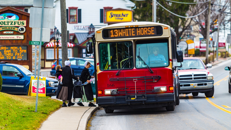 Amish women board bus