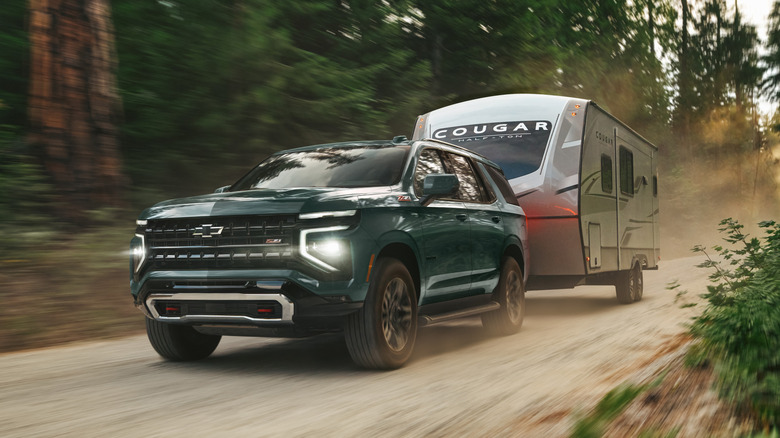 2025 Chevrolet Tahoe front 3/4 view while towing on gravel
