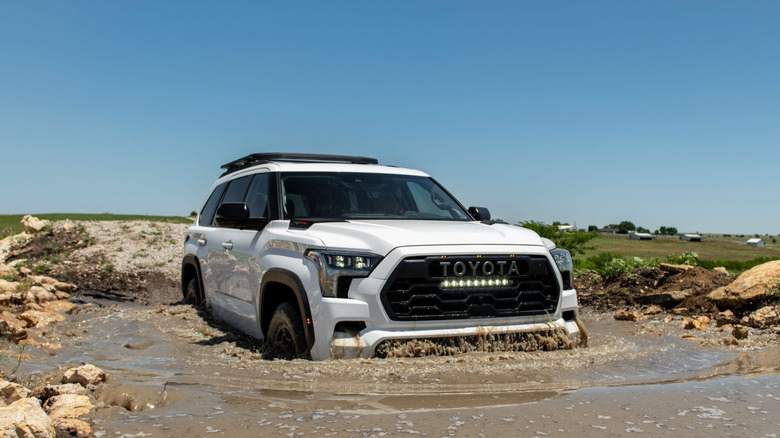 2025 Toyota Sequoia TRD Pro front 3/4 view while driving through deep water
