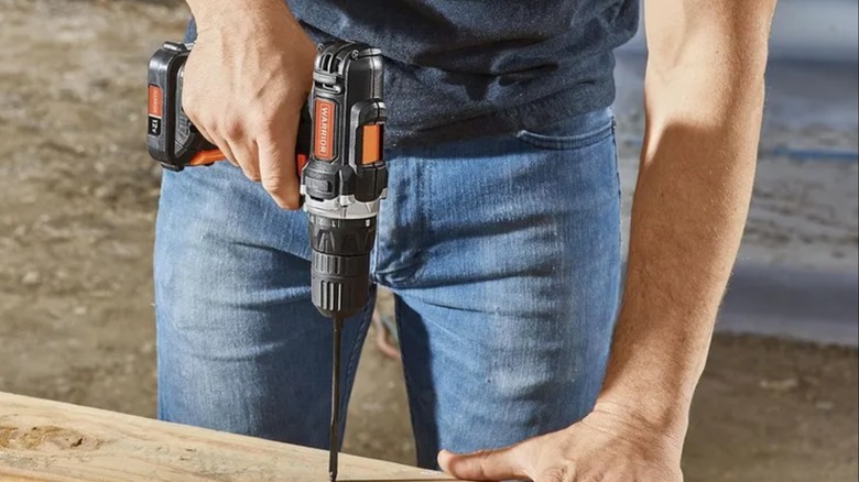 Drilliing into wood with Warrior 12V 3/8-Inch Drill.
