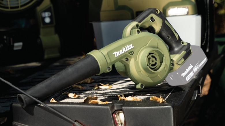 Makita Outdoor Adventure 18V LXT Blower on a truck bed with other Makita products in the background