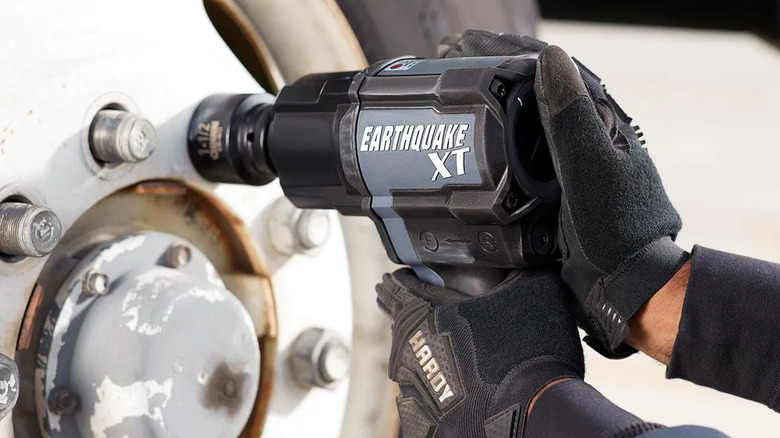 Earthquake XT ¾-inch composite air impact wrench with a truck wheel