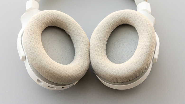 The cushions on some white headphones