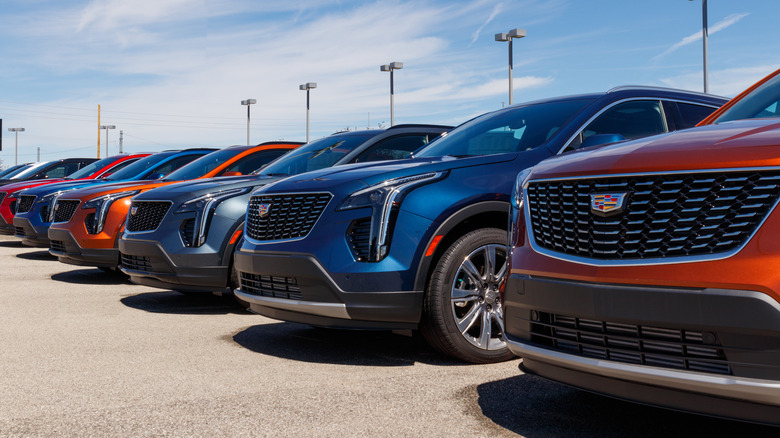 Cadillacs lined up at a dealership