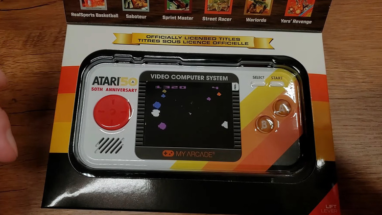 A close up of the My Arcade Atari Pocket Player Pro in its packaging