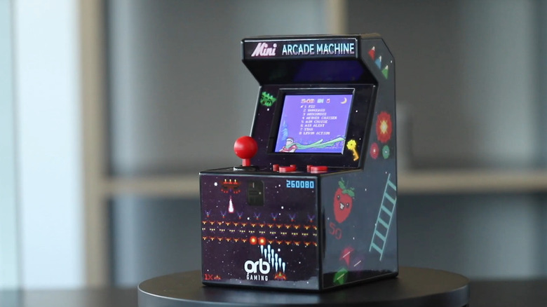 A close-up of the Thumbs Up Mini Arcade Machine