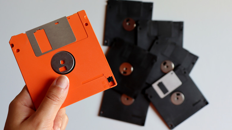 Floppy disks being held by a hand