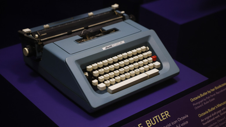 A typewriter on display on a stand