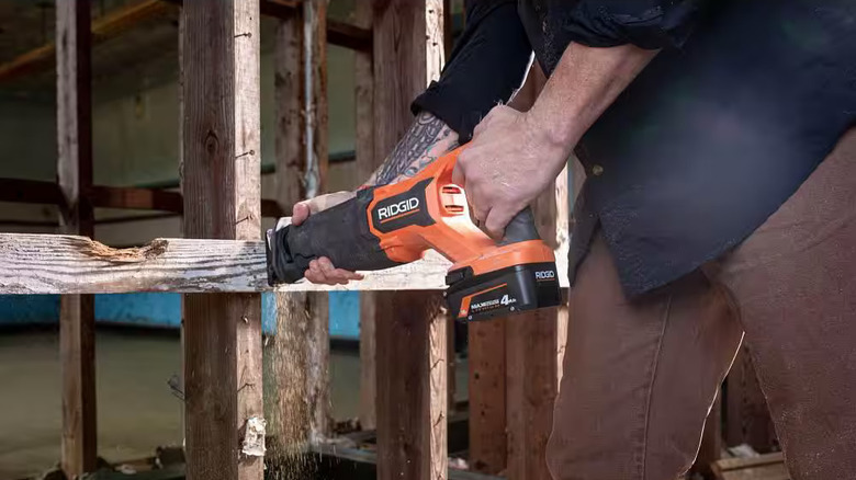Man uses Ridgid Reciprocating Saw