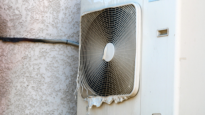 A melted outdoor unit with a burned cable connected to it