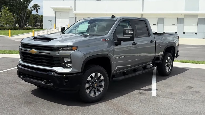 A silver 2025 Chevrolet Silverado 2500 HD parked in parking area