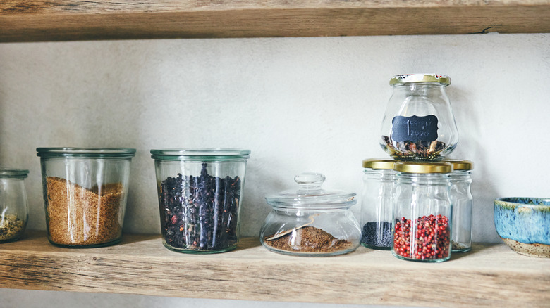 spices on a wooden shelving unit