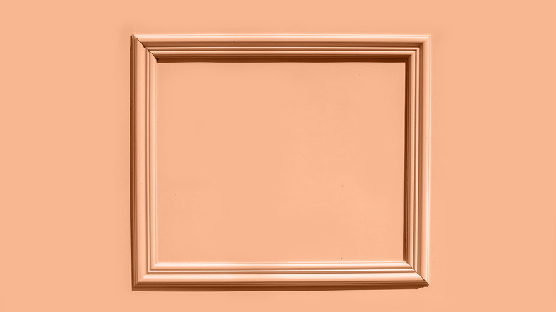 peach picture frame on peach background