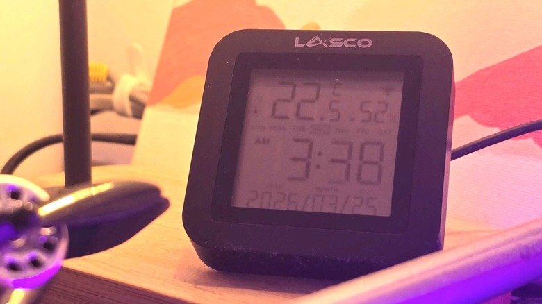 a smart remote under a desk lamp