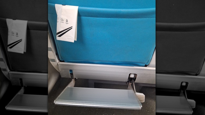 a footrest on an airplane economy seat