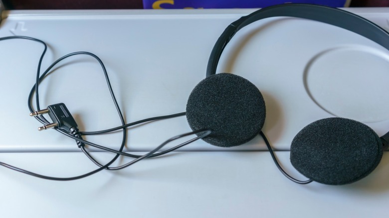 a pair of headphones for airplane seats