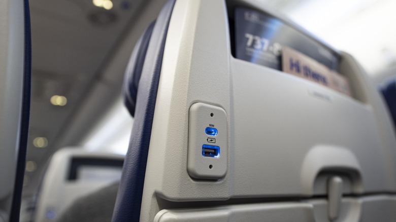 a fast-charging USB-C port and USB-A port on the back of a seat