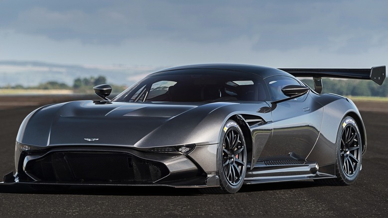 The Aston Martin Vulcan parked with storm clouds0 behind it