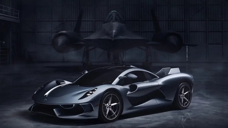The Hennessy Blackbird parked in front of a rendering of an SR-71 Blackbird