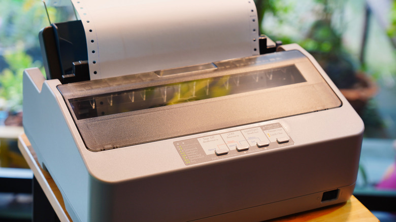 A dot matrix printer in action.