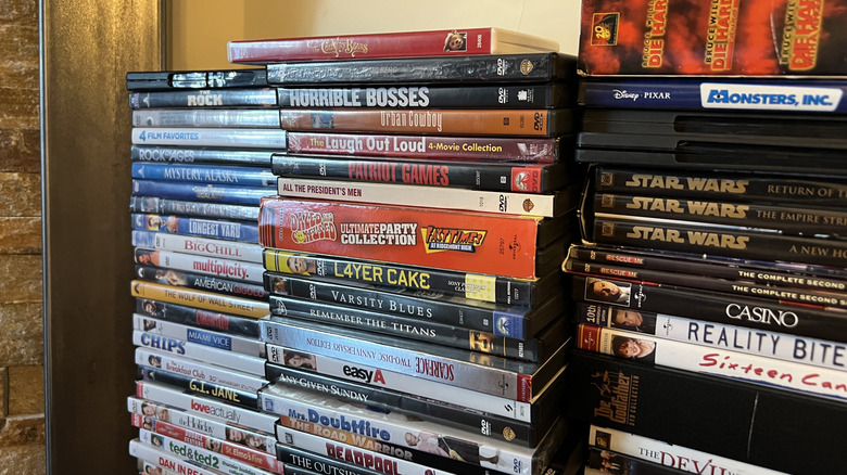 An assorted collection of DVD movies.