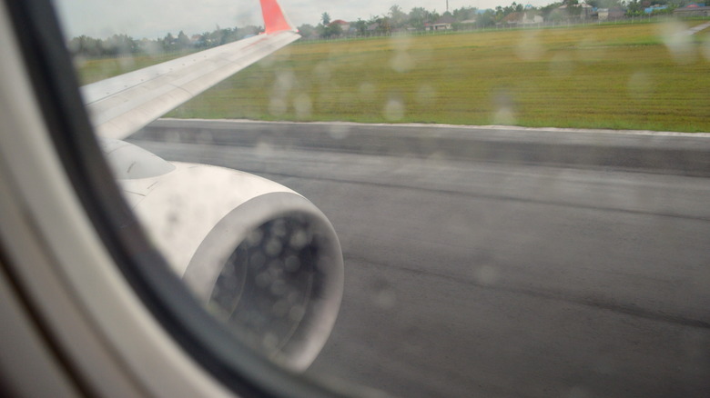 Plane landing in the rain
