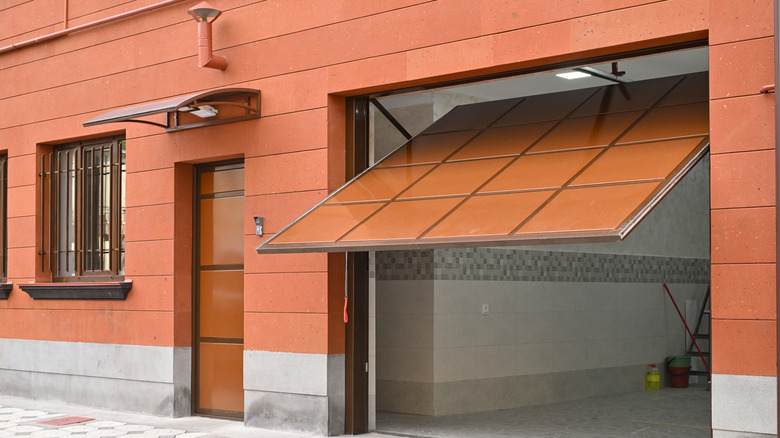 A half-open garage door.