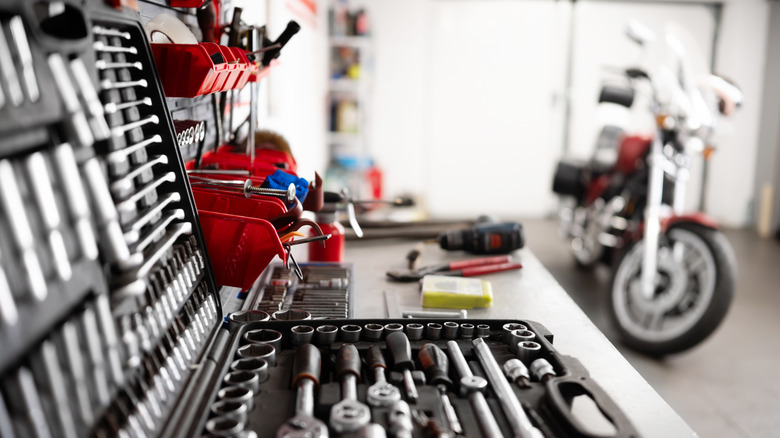 Close up of a tool box on a table in a garage.