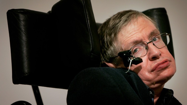 Stephen Hawking in black chair