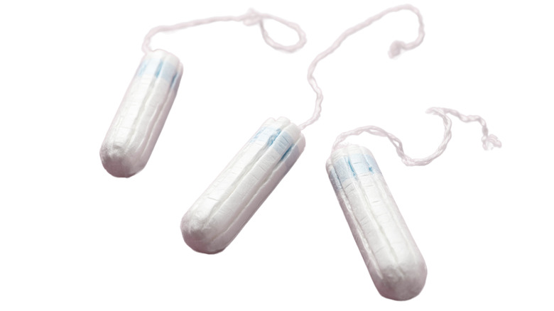 A tampon on a wooden floor