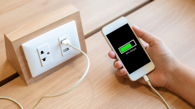 A phone being charged at a USB charging station