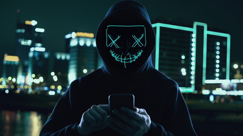 A hacker accessing a compromised phone