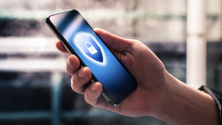 A hand holding a protected phone