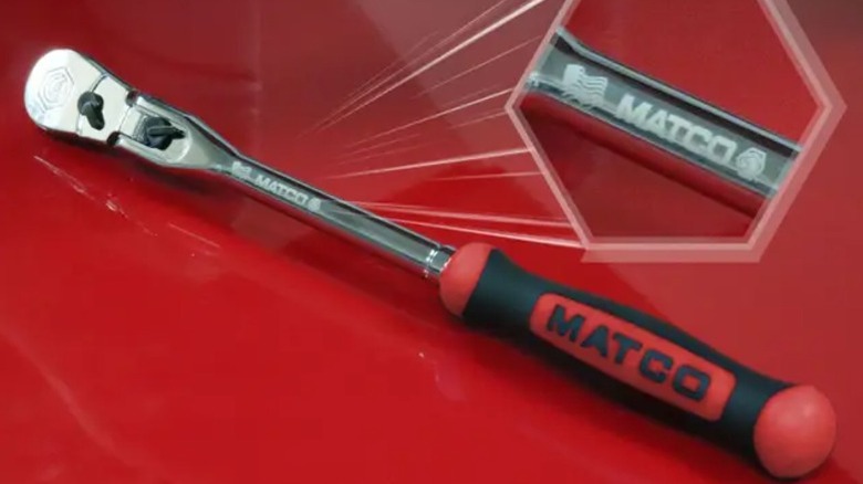 A Matco Tools flex-head ratchet placed on a glossy red surface, with a zoomed-in inset showing the Matco logo.