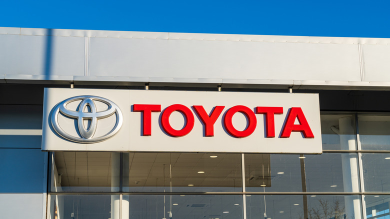 Toyota logo on car dealership