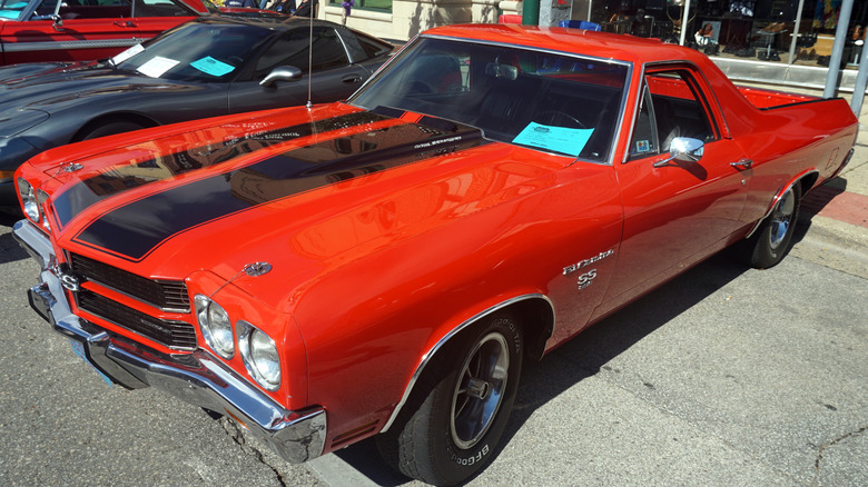 1970 El Camino parked on the sidewalk at an outdoor classic car show