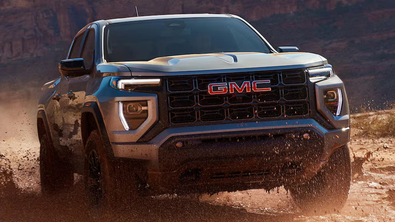 Front view of GMC Canyon driving through mud