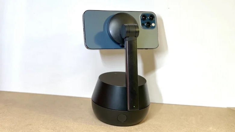 Belkin Auto-Tracking Stand Pro with iPhone on white background.