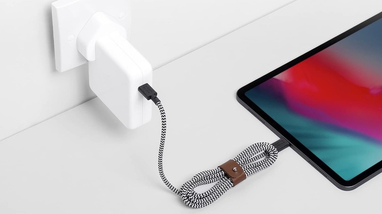 Native Union Type-C Belt Cable connected to a wall charger and tablet.
