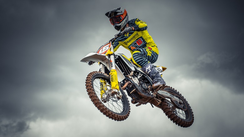 A rider clocking airtime on top of a Husqvarna FC 450 from 2017