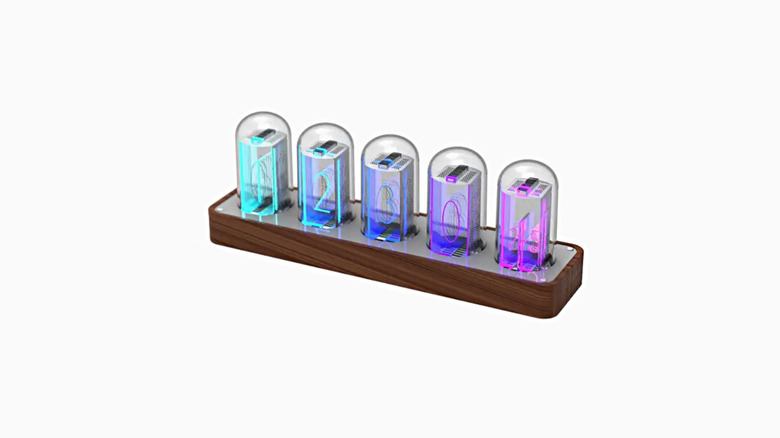 Five imitation nixie tubes rest on a wooden surface, each in a container that looks like a vacuum tube.