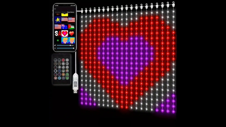 An LED curtain displays the image of a heart on a black background, next to it there is a picture of a phone using an app to customize the light