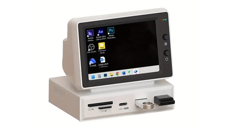 A miniature fake CRT monitor displaying the time and date