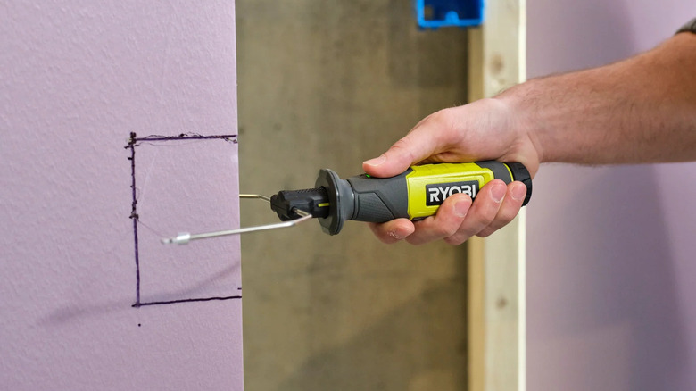 Ryobi USB Lithium foam cutter slicing a large piece of foam.