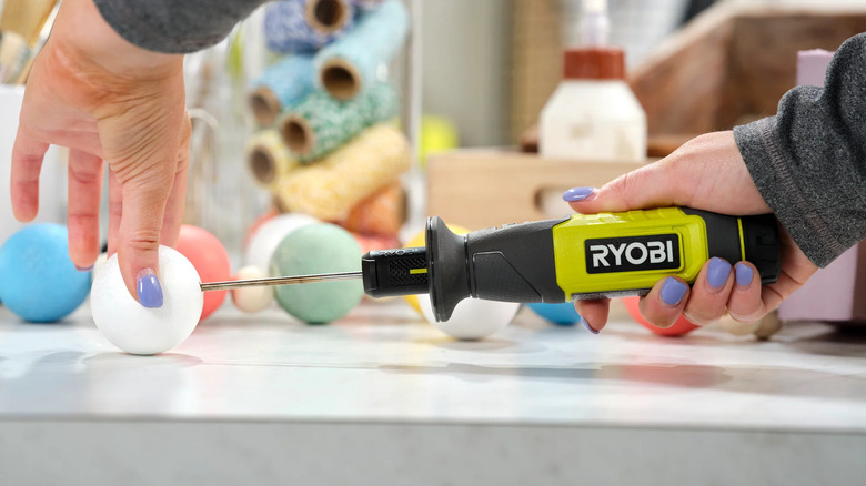 Ryobi USB Lithium foam cutter cutting a foam ball.
