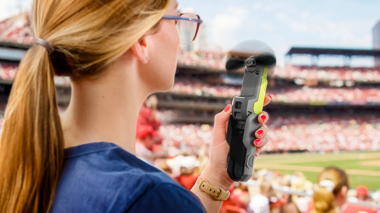 Ryobi USB Lithium handheld fan used at a sports game.